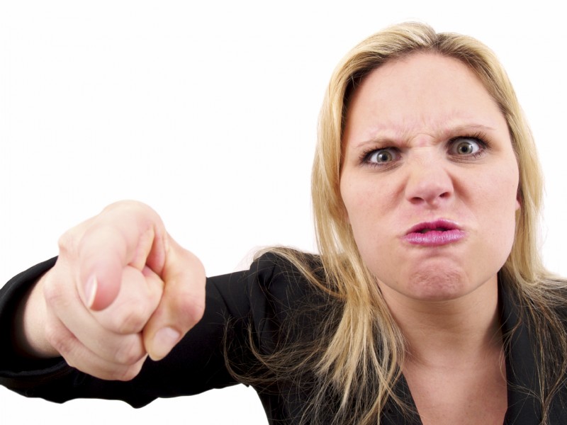Angry woman pointing - anger disguised as boundaries