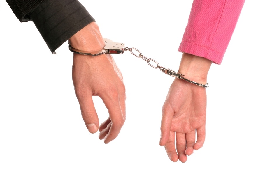Man and woman handcuffed to each other